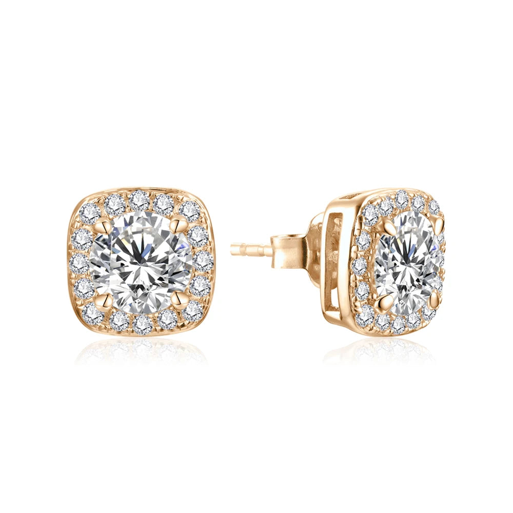 chic gold moissanite stud earrings with a large center stone and delicate surrounding moissanites.