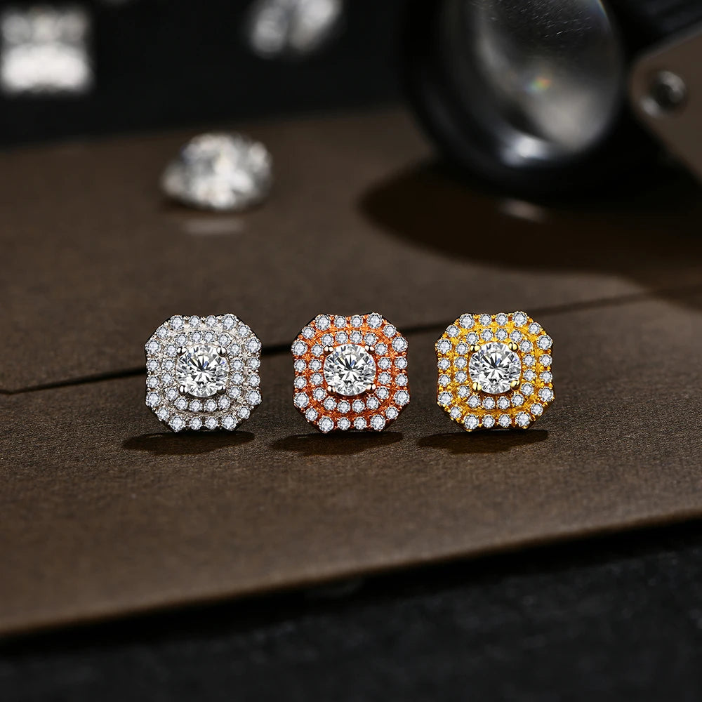 luxurious gold moissanite earrings featuring a large center stone surrounded by tiny moissanites.