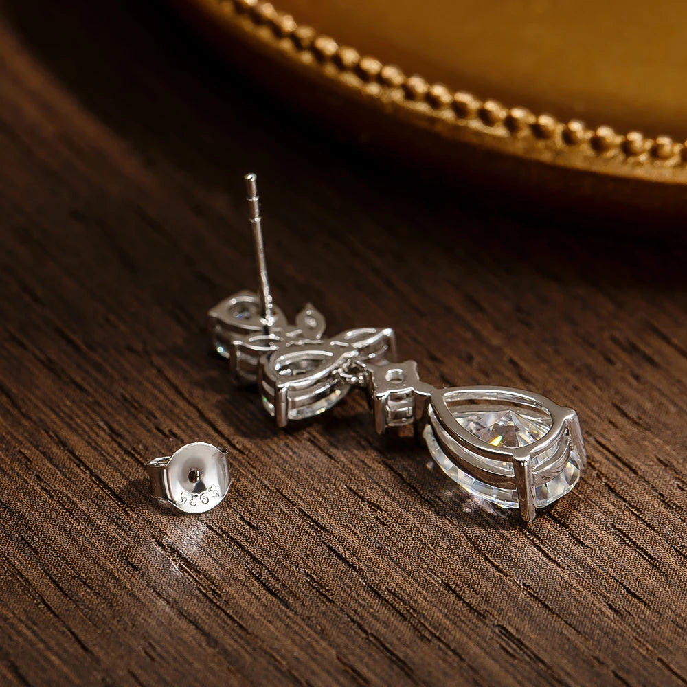 silver moissanite stud earrings transformed into floral drop earrings perfect for brides gram moissanite for a polished bridal finish
