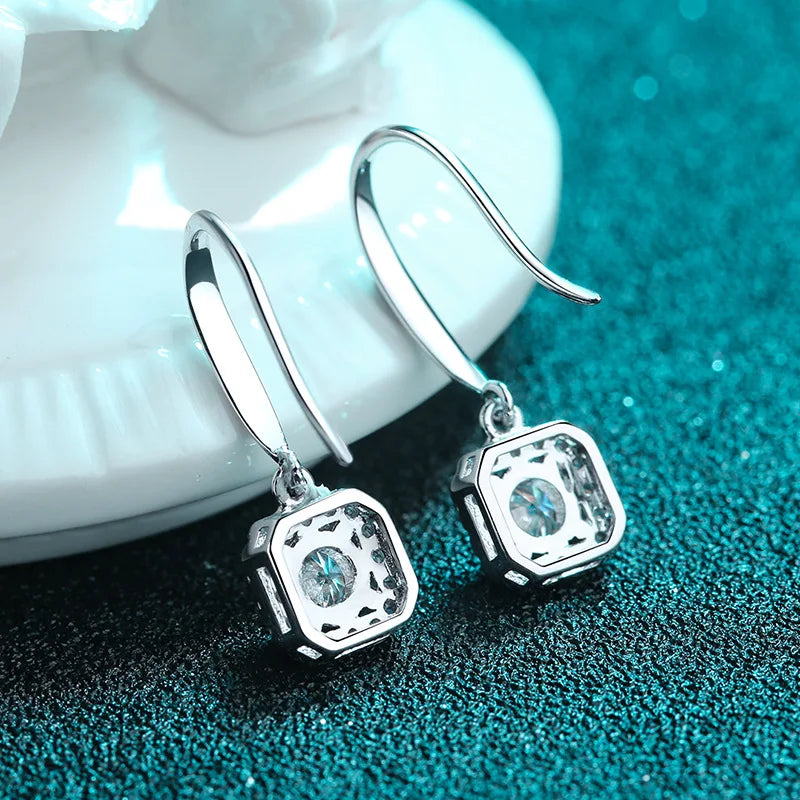 silver moissanite earrings elegant drop earrings with a larger stone in the middle and smaller on the sides lab created diamonds for a dazzling effect