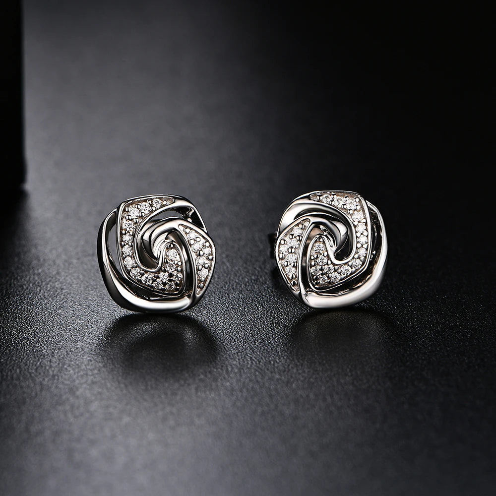 luxurious silver moissanite stud earrings featuring a classic twisted pattern.