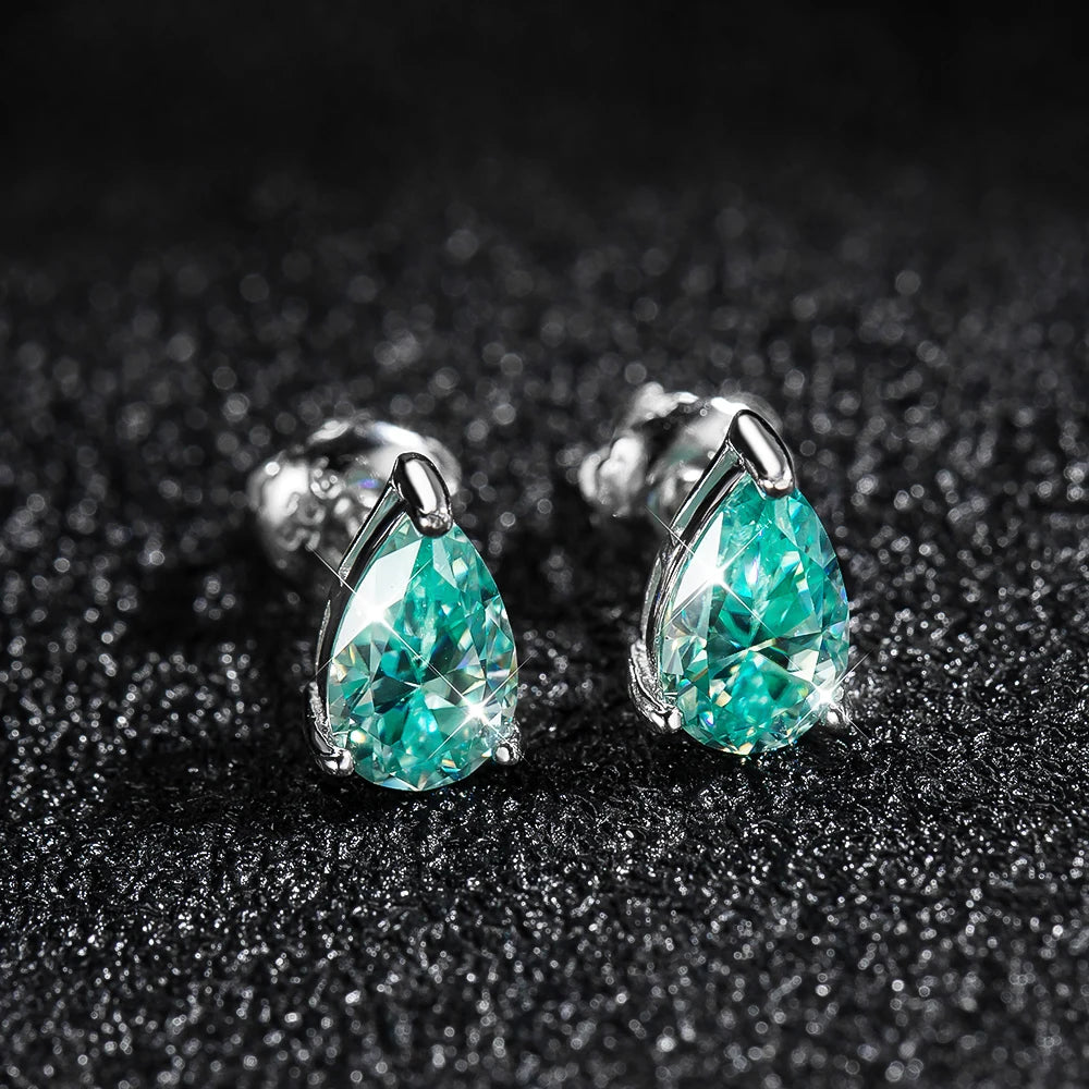 silver moissanite vintage earrings adorned with green pear moissanite lab created diamonds for a classic appeal