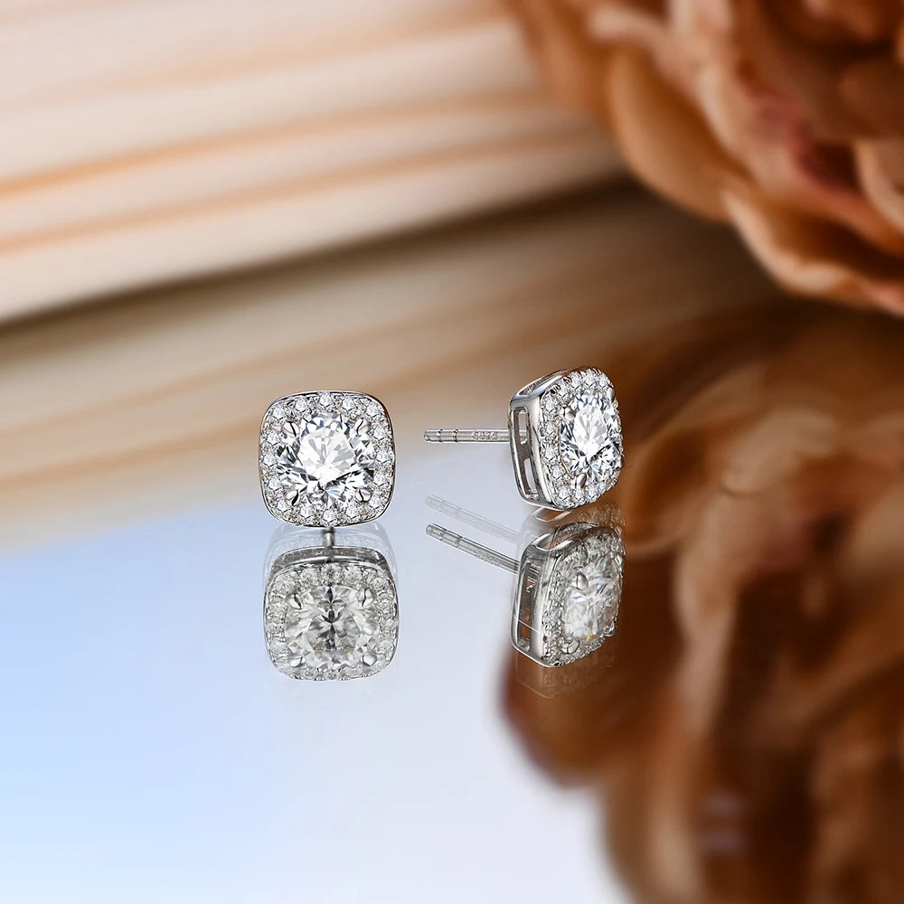 stunning silver moissanite halo stud earrings with a radiant center stone.