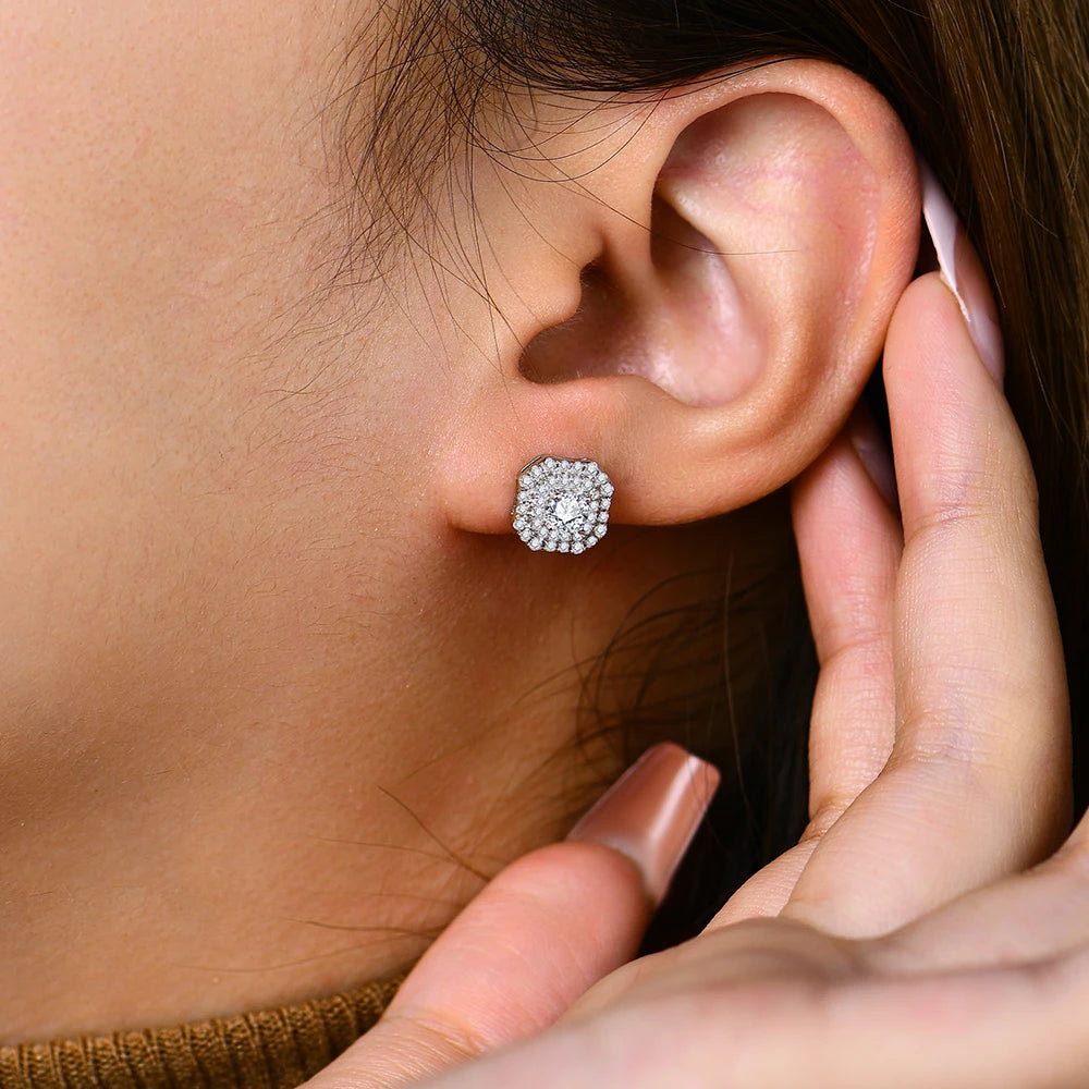 eye-catching silver moissanite statement stud earrings with a radiant central gemstone.
