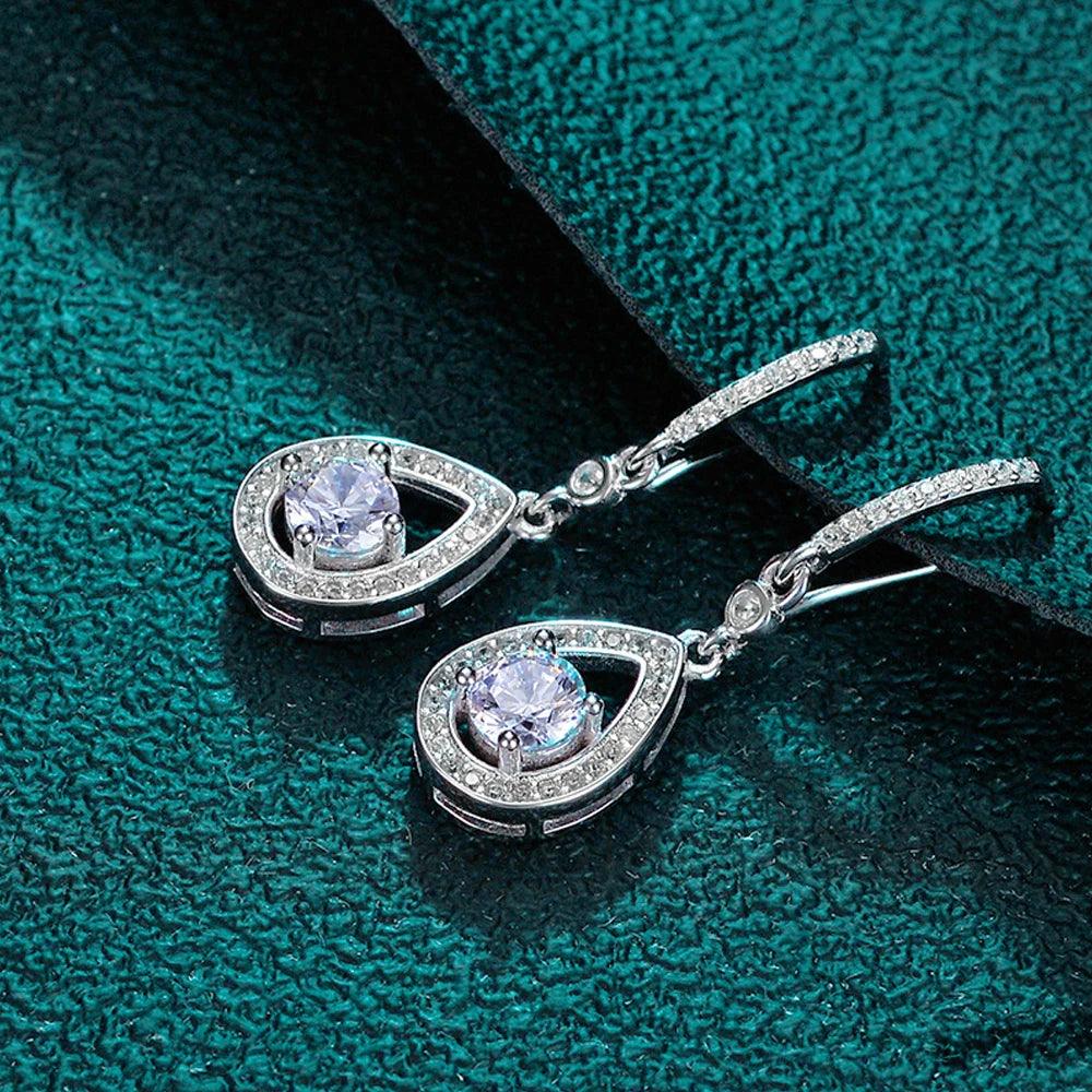 silver moissanite earrings transformed into drop earrings with a center stone gram moissanite for a polished finish