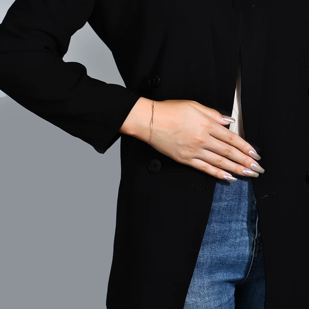woman wearing a diamond bracelet featuring moissanite stones