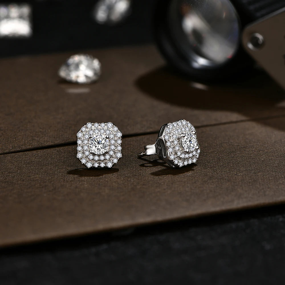 stunning silver moissanite earrings with a delicate halo of small stones.