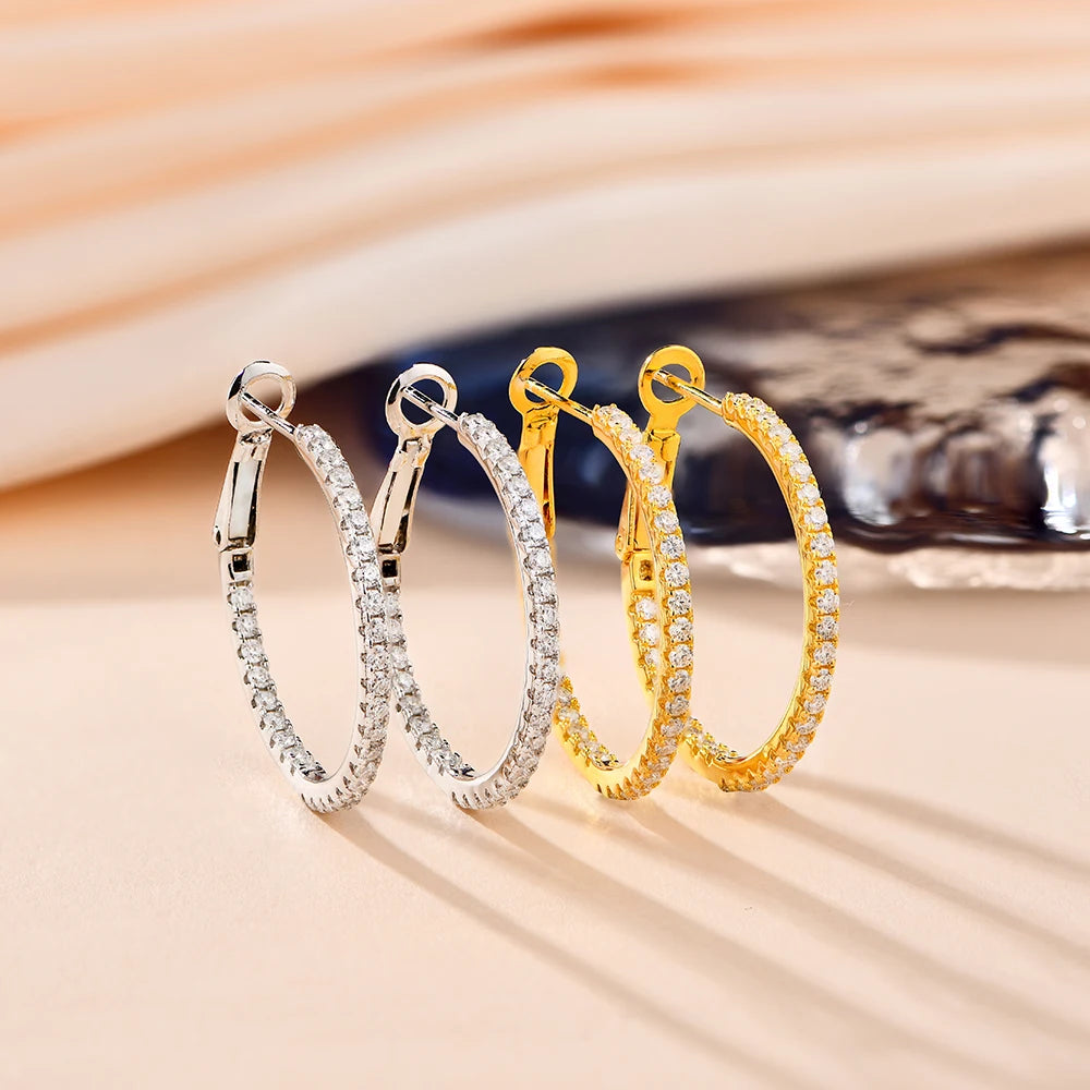 elegant gold moissanite hoop earrings, perfect for adding sophistication to any outfit.