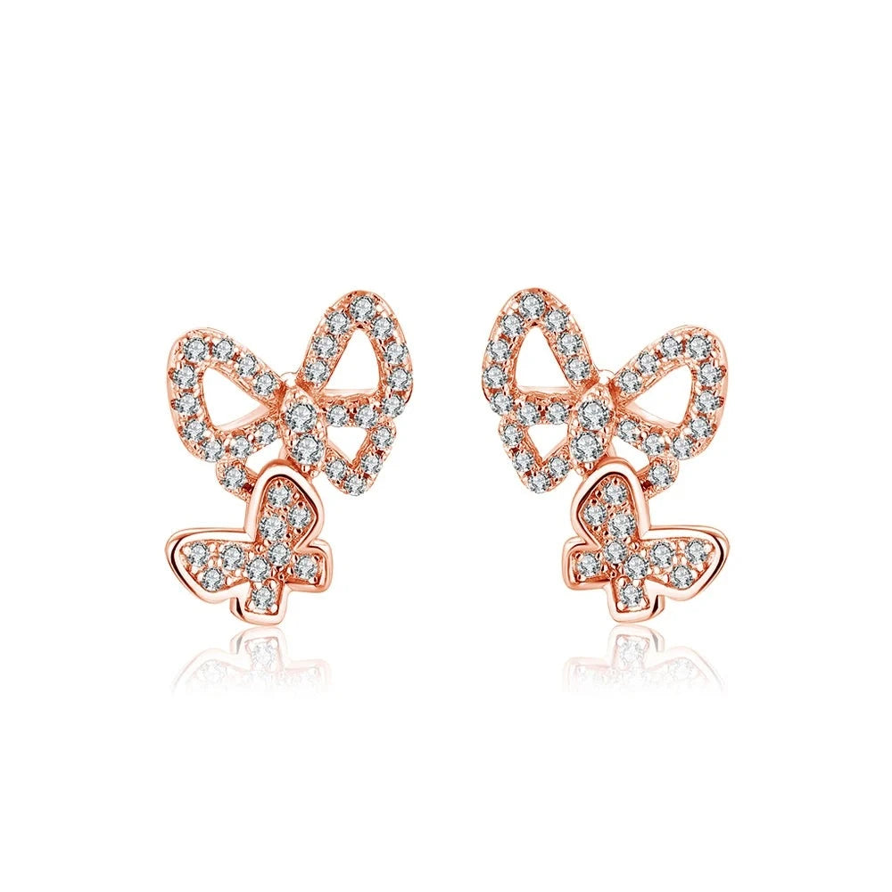 Elegant gold moissanite earrings with nature-inspired detailing and sparkling accents.