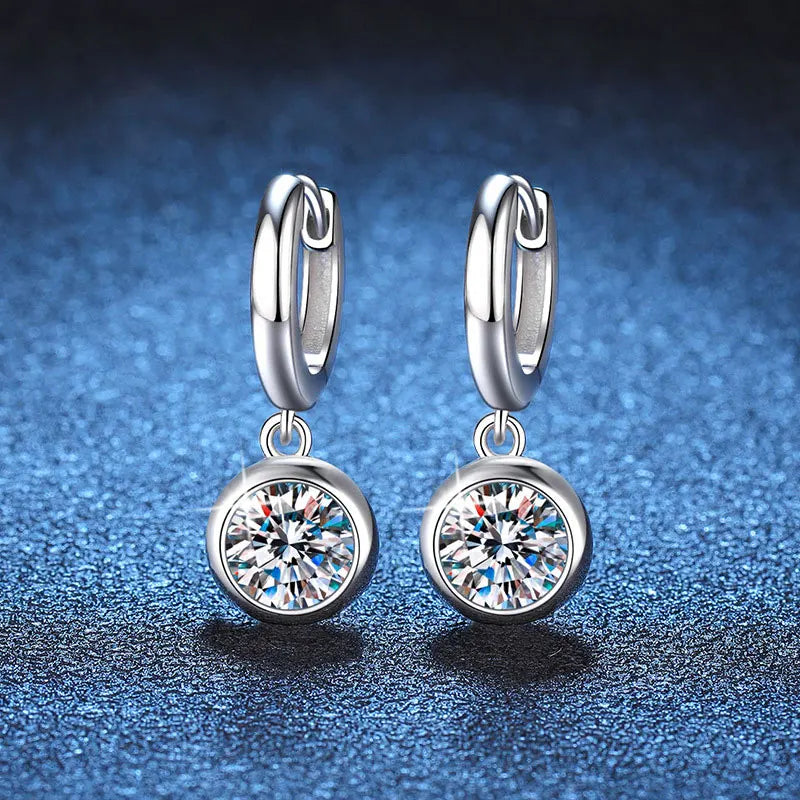 silver moissanite stud earrings transformed into drop earrings with a small stone gram moissanite for a polished finish