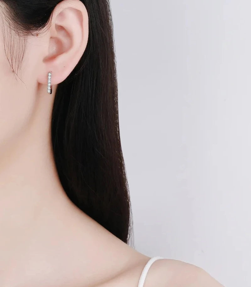 Exquisite vintage moissanite earrings with intricate detailing and classic charm.