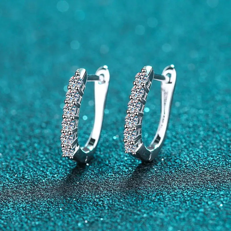 Chic silver moissanite clip earrings with dazzling stones for effortless elegance.